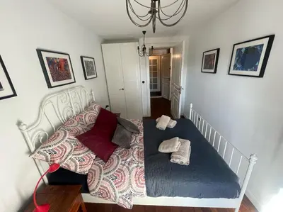 a bedroom with a bed with pillows on it at Royal Oak - 3BD 2BA apartment with parking and river view in Kraków