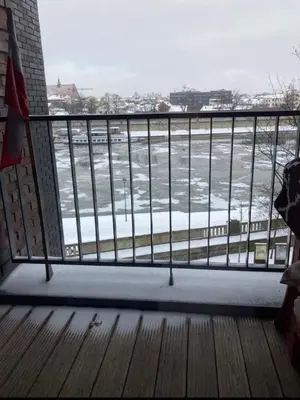 a balcony with a view of a body of water at Royal Oak - 3BD 2BA apartment with parking and river view in Kraków