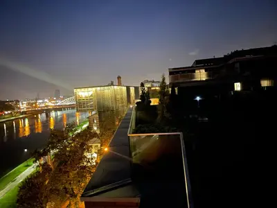 a view of a city at night with a river at Royal Oak - 3BD 2BA apartment with parking and river view in Kraków