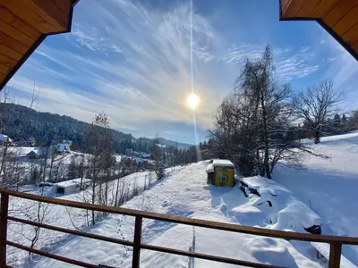 a view from a balcony of a snow covered yard at Apartament Guziczek2 in Nowy Targ