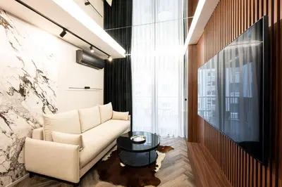 a living room with a couch and a table at Native Apartments Kościuszki 39/28 in Kraków