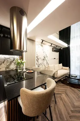 a living room with a table and some chairs at Native Apartments Kościuszki 39/28 in Kraków