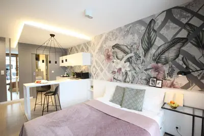 a bedroom with a bed and a wall mural at VIVA GREEN & NATUR Apt close to Vistula River - by Homelike Krakow in Kraków