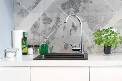 a kitchen sink with a faucet on a counter at VIVA GREEN & NATUR Apt close to Vistula River - by Homelike Krakow in Kraków