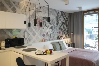a bedroom with a bed and a table with fruit on it at VIVA GREEN & NATUR Apt close to Vistula River - by Homelike Krakow in Kraków