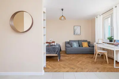 a living room with a couch and a table at Kraków Eagle Pharmacy Studio by Noclegi Renters in Kraków