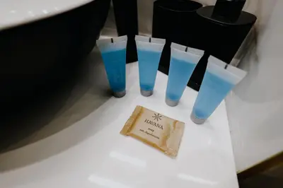 a group of four blue glasses sitting on a table at Nowy Złocień Comfort Apartment by BookingHost in Kraków