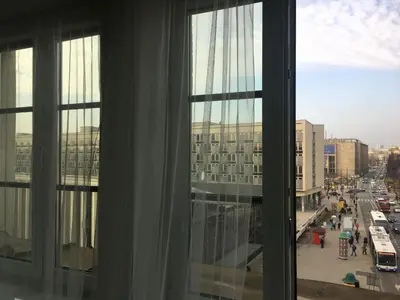 a view of a city street from a window at Cracovia Apartments in Kraków
