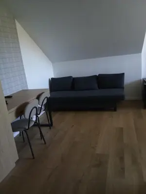 a living room with a couch and two chairs at MODRZEW - noclegi w Pyzówce in PyzÃ³wka