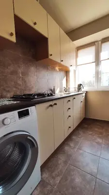 a kitchen with a washing machine and a sink at Blachnickiego 9 by Homeprime in Kraków