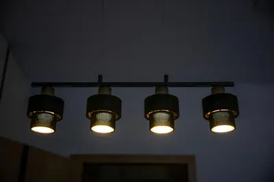 a black and yellow chandelier hanging from a wall at Native Apartments Słowackiego 14 Deluxe in Kraków