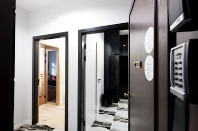 two elevators in a room with a door at Native Apartments Słowackiego 14 Deluxe in Kraków