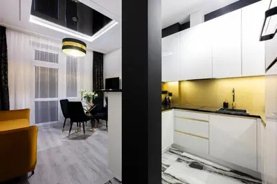 a dining room with a table and black chairs at Native Apartments Słowackiego 14 Superior in Kraków