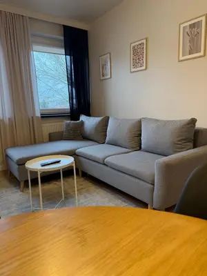 a living room with a couch and a table at M&S Apartment in Kraków