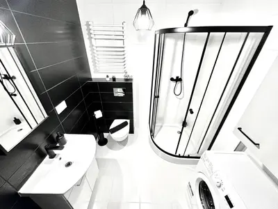 a bathroom with a toilet sink and a shower at COZY OLD-Town Apartments at Kazimierz +AC, KITCHEN and NETFLIX in Kraków