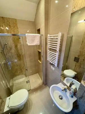 a bathroom with a toilet and a sink and a shower at Uroczysko pod Mogielicą in Szczawa