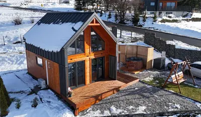 an overhead view of a tiny house in the snow at Widokowe Stodoły balia z hydromasażem na wylączność in Chyszówki
