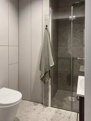 a bathroom with a shower and a toilet and a sink at Apartament BonHaus WiślaneTarasy in Kraków
