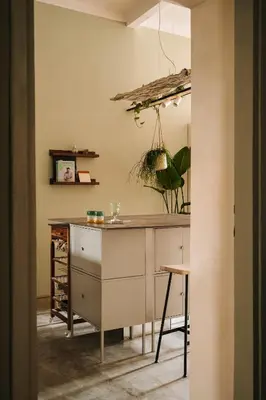 a kitchen with a counter and a table in a room at HERE Apartments in Kraków