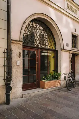 a bike parked outside of a building with a door at HERE Apartments in Kraków