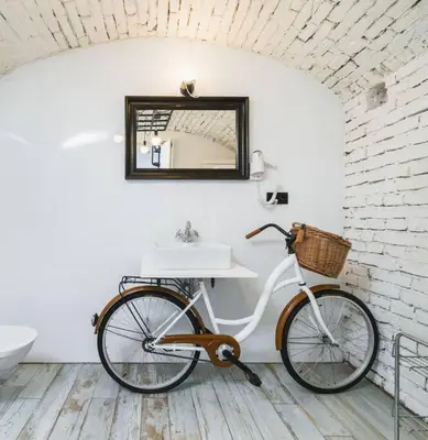 a bike parked in a bathroom with a sink at Vélo Apartment, High Standard, TV, WiFi in Kraków