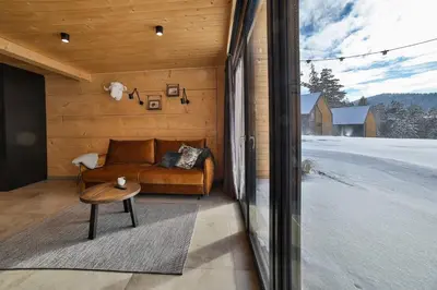 a living room with a couch and a table at Bocianie Gniazdo w Rabce in Rabka-Zdroj