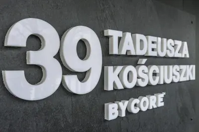 a sign for the tesla company logo at a store at RentPlanet - Apartamenty Kościuszki in Kraków