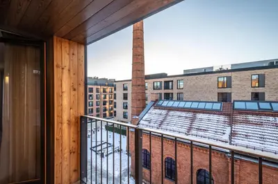 a balcony with a view of a building at RentPlanet - Apartament Lubicz in Kraków