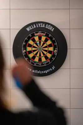 a dart board on a wall with a dartboard at Willa Łysa Góra Limanowa in Limanowa