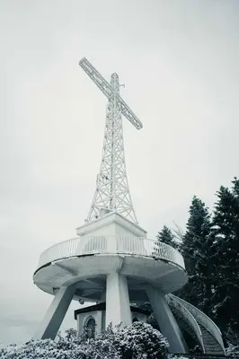 a tower with a cross on top of it at Willa Łysa Góra Limanowa in Limanowa