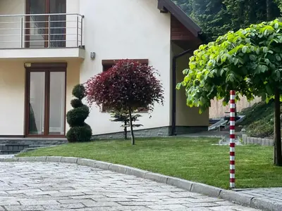 a house with a yard with a brick driveway at Willa Łysa Góra Limanowa in Limanowa