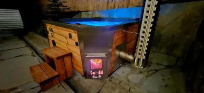 a bath tub with a blue water inside of it at Willa Łysa Góra Limanowa in Limanowa