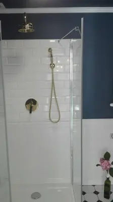 a shower with a glass door in a bathroom at Z widokiem- Old Town in Kraków