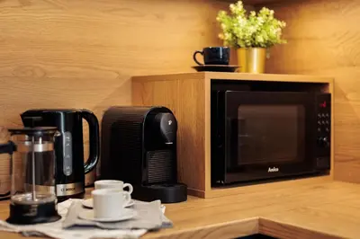 a microwave sitting on top of a kitchen counter at Colorful Cracovia Apartments - by Upstairs in Kraków