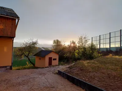 a small house sitting on top of a hill at Noclegi nad S-ką in Miechów