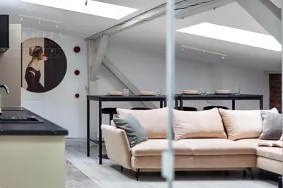 a living room with a couch and a table at Spacious apartment 11 PAX, Vistula River - Fragola Apartments in Kraków