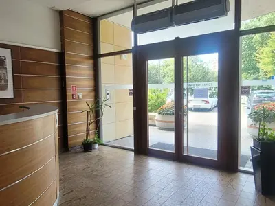 an entrance to a building with a sliding glass door at Verona Apartament 115, 69m2, Terrace, Garage in Kraków