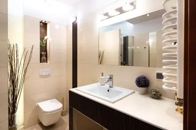 a bathroom with a sink and a toilet and a mirror at Verona Apartament 115, 69m2, Terrace, Garage in Kraków