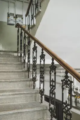 a set of stairs in a building with a stair railing at Vitrum Apartments in Kraków