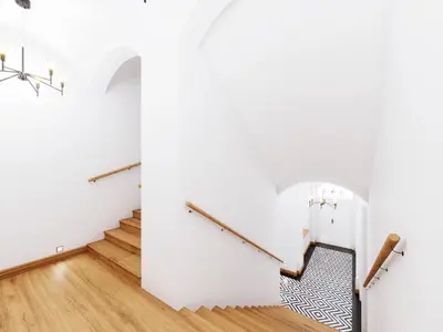 a stairwell with white walls and wooden floors at Deluxe Vintage Chic Apartment - Kazimierz Old Town in Kraków