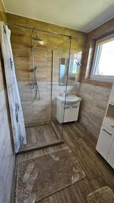 a bathroom with a shower and a sink at BliżejGorców in Lubomierz