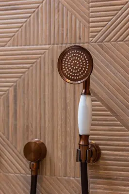 a brown and white lamp on a wall at Prandoty Beautiful Apartment with Balcony Cracow by Renters Prestige in Kraków