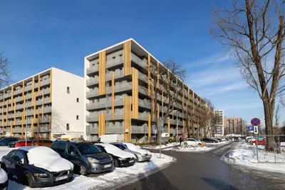 a parking lot with cars parked in front of a building at Prandoty Beautiful Apartment with Balcony Cracow by Renters Prestige in Kraków