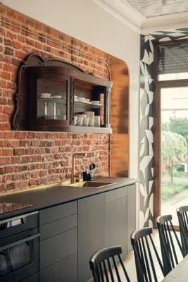 a kitchen with a brick wall and a sink at Austin Flowers Old Town by WillyWalls in Kraków