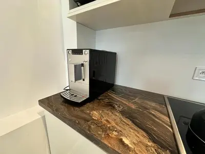 a computer monitor sitting on top of a counter at Pawia Apartments Centrum in Kraków