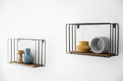 a couple of shelves with vases on them at Native Apartments Pułaskiego 6 in Kraków