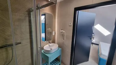 a bathroom with a sink and a mirror at Piotruś Pan in Brzesko