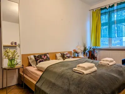 a bedroom with two beds and a window at Aleja Krasińskiego 24A by Homeprime in Kraków