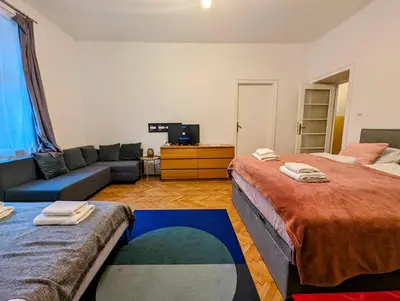a living room with two beds and a couch at Aleja Krasińskiego 24A by Homeprime in Kraków