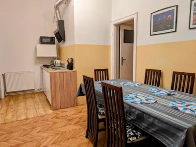 a dining room with a table and chairs at Aleja Krasińskiego 24A by Homeprime in Kraków